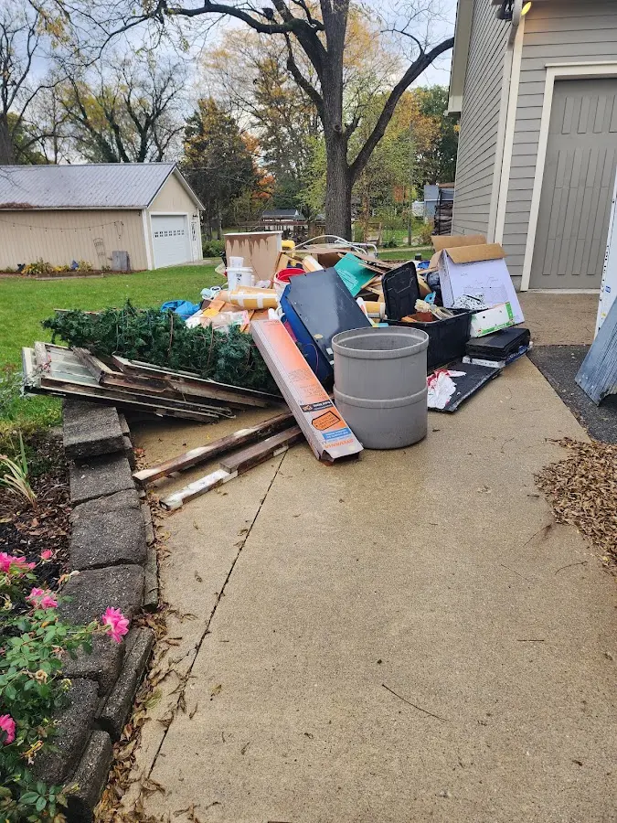 Dumpster being loaded with debris for Residential Dumpster Rental in Fort McKinley